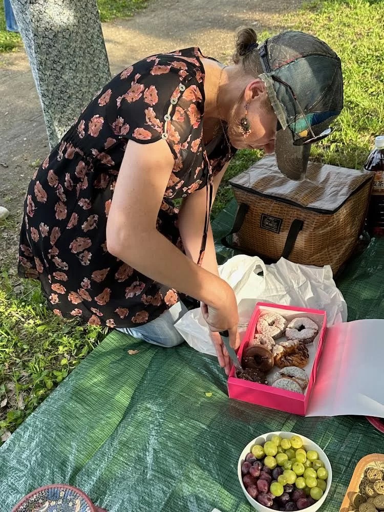 Felicity cutting donuts (photo by Jann Williams)